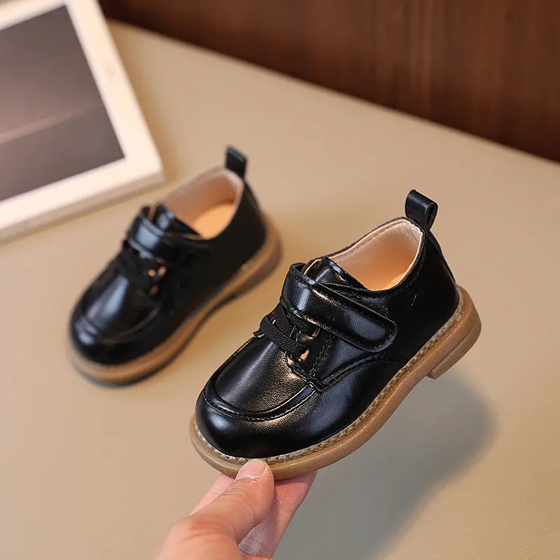 boys leather shoes, close up, black 